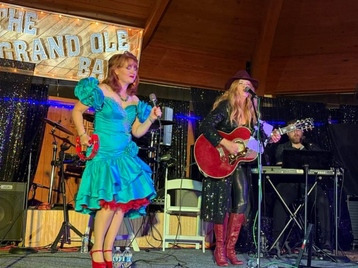 Full band on stage at the Grand Ole Barn